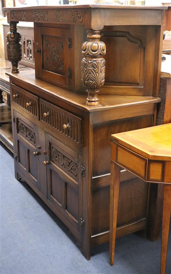 A 17th century style carved oak court cupboard W.127cm